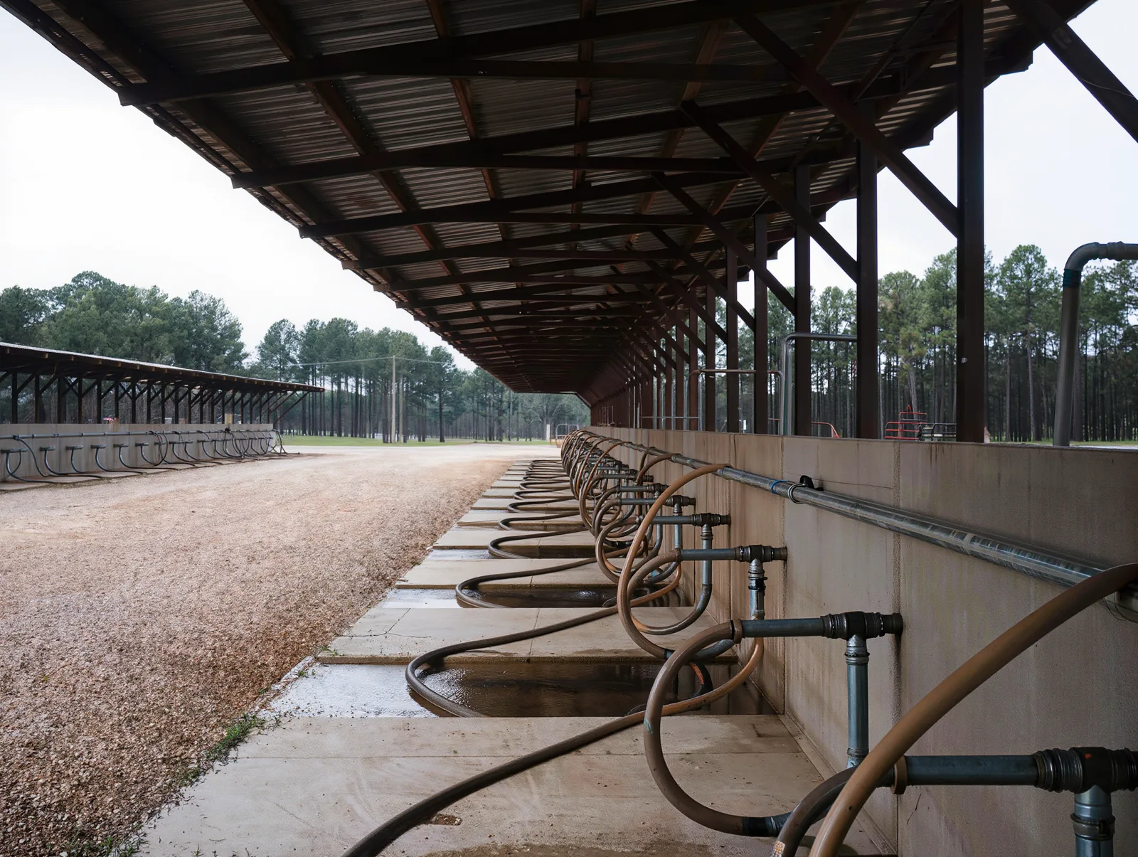 Reference example of the covered wash racks, a generated placeholder showing the photo we want, not the actual Sabine County Expo Center.